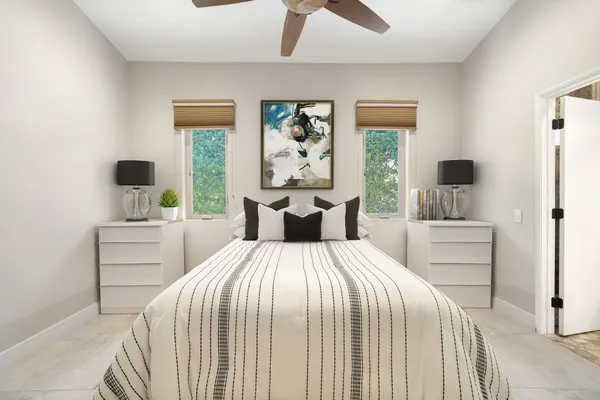 a bedroom with a flat screen tv and a bed