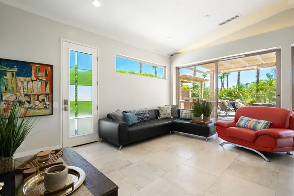 a living room with furniture and a large window
