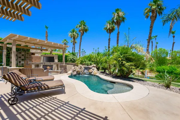 a view of a swimming pool with a patio