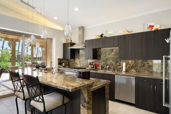 a living room with kitchen island furniture and a large window