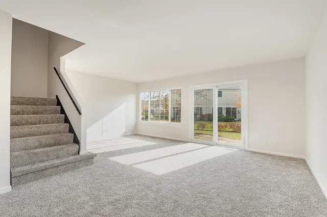 a view of an empty room with stairs