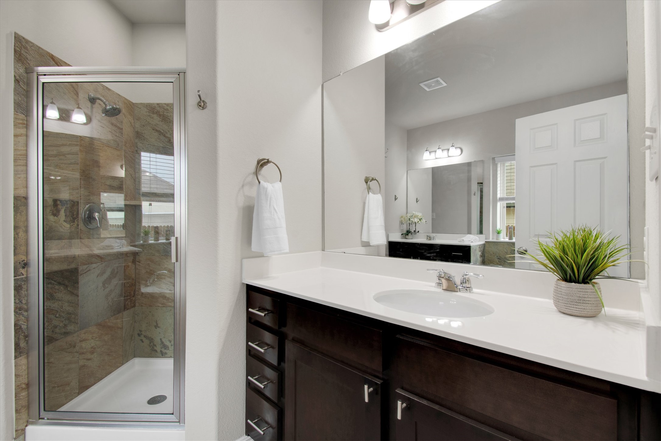 13601 Larrys Lane Manchaca, TX 78652 - Photo 17 of 40 Bathroom featuring vanity and a shower stall