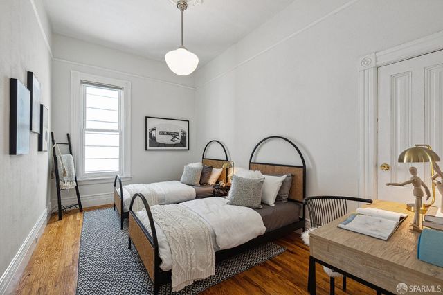 a bedroom with bed and a window