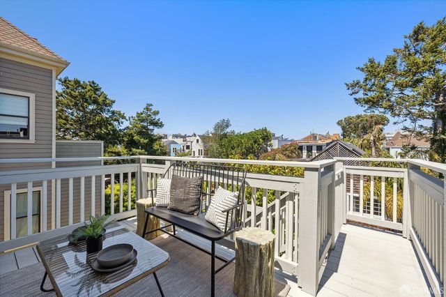 a view of a balcony with chairs