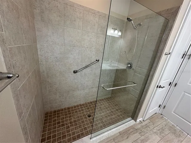a bathroom with a shower and toilet