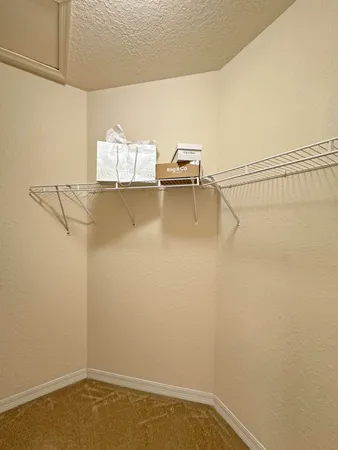 a view of a room with racks on the wall
