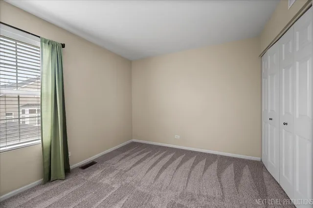 a view of a room that has a window in it