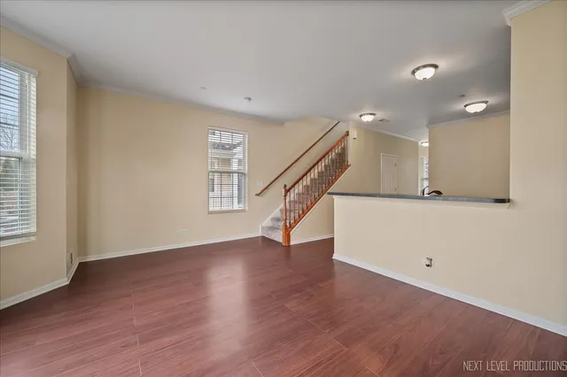 a view of an entryway with wooden floor