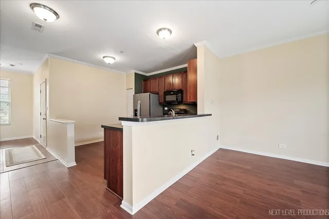 a view of kitchen and wooden floor