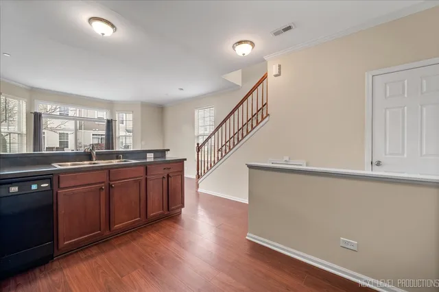 a room with lots of wooden floors and cabinets