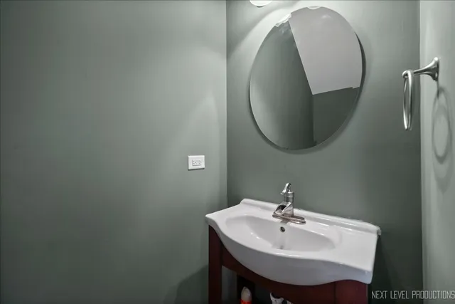 a bathroom with a sink and mirror