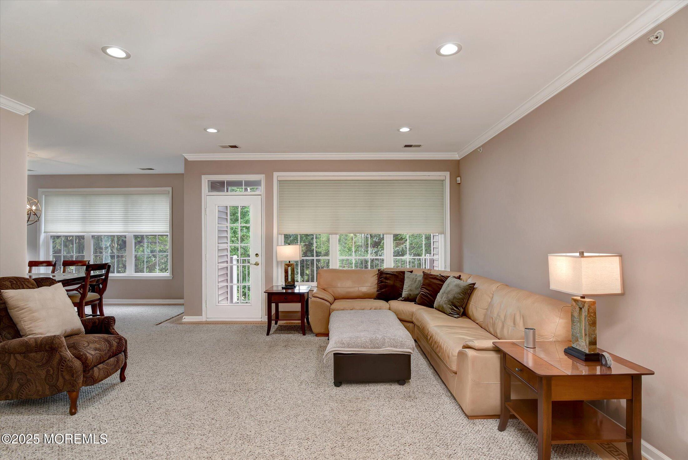 594 St Andrews Place Manalapan, NJ 07726 - Photo 11 of 35 a living room with furniture and a large window