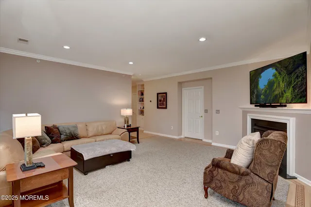 a bedroom with furniture and a flat screen tv