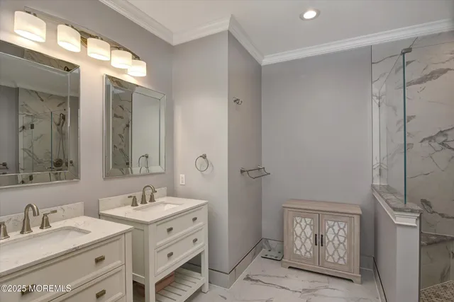 a bathroom with double vanity sink and a mirror