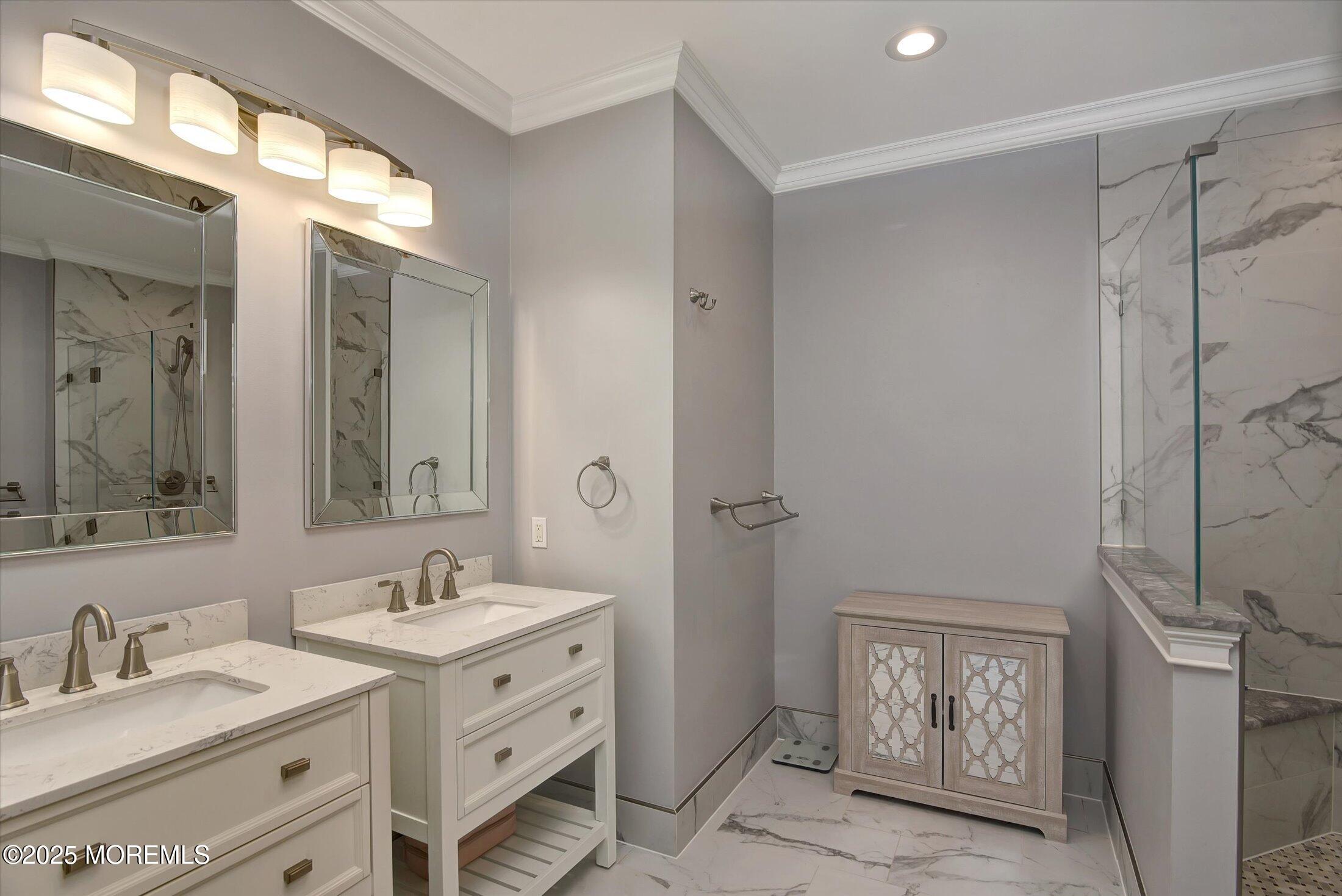 594 St Andrews Place Manalapan, NJ 07726 - Photo 18 of 35 a bathroom with double vanity sink and a mirror