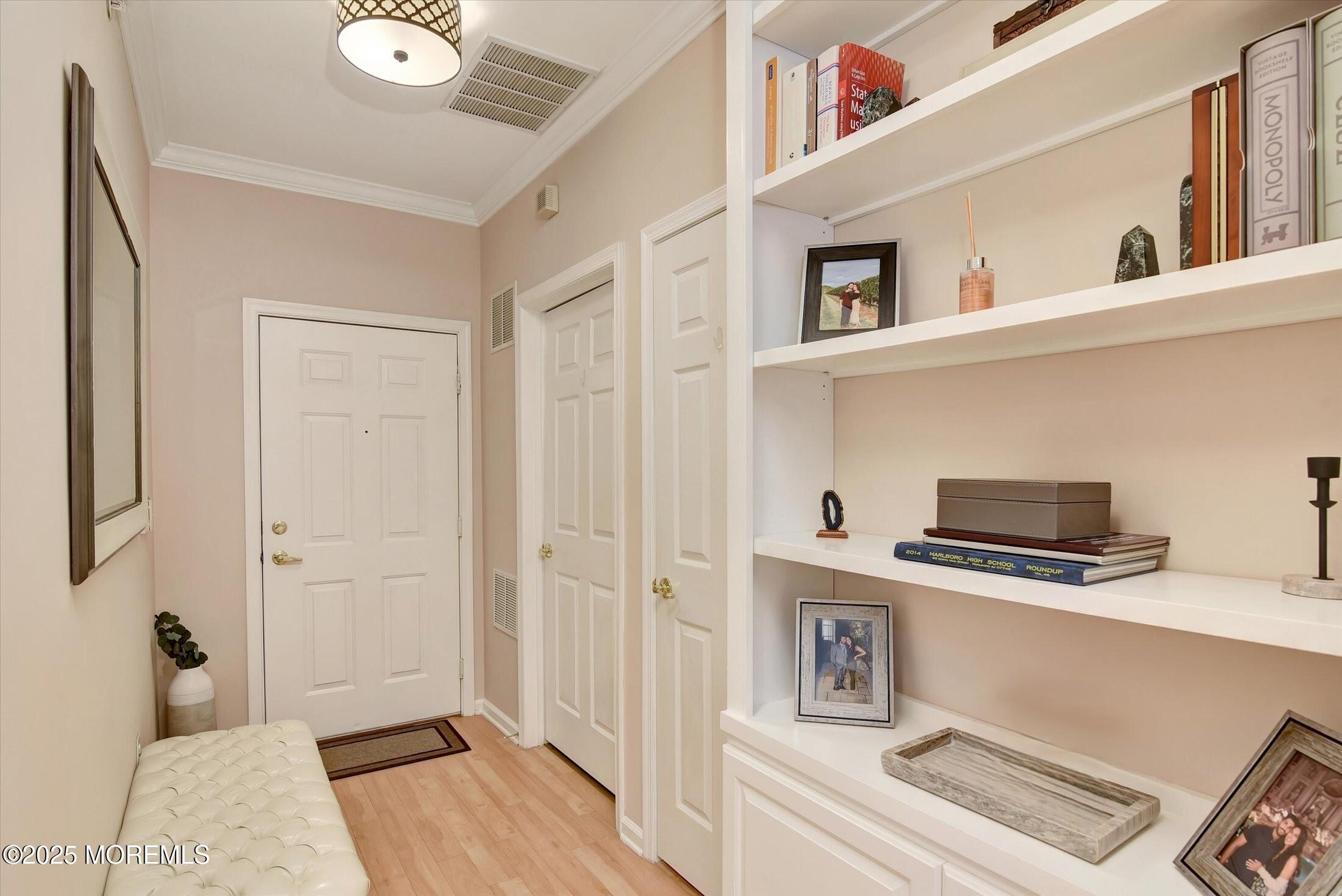 594 St Andrews Place Manalapan, NJ 07726 - Photo 24 of 35 a kitchen with stainless steel appliances a stove a microwave and a refrigerator