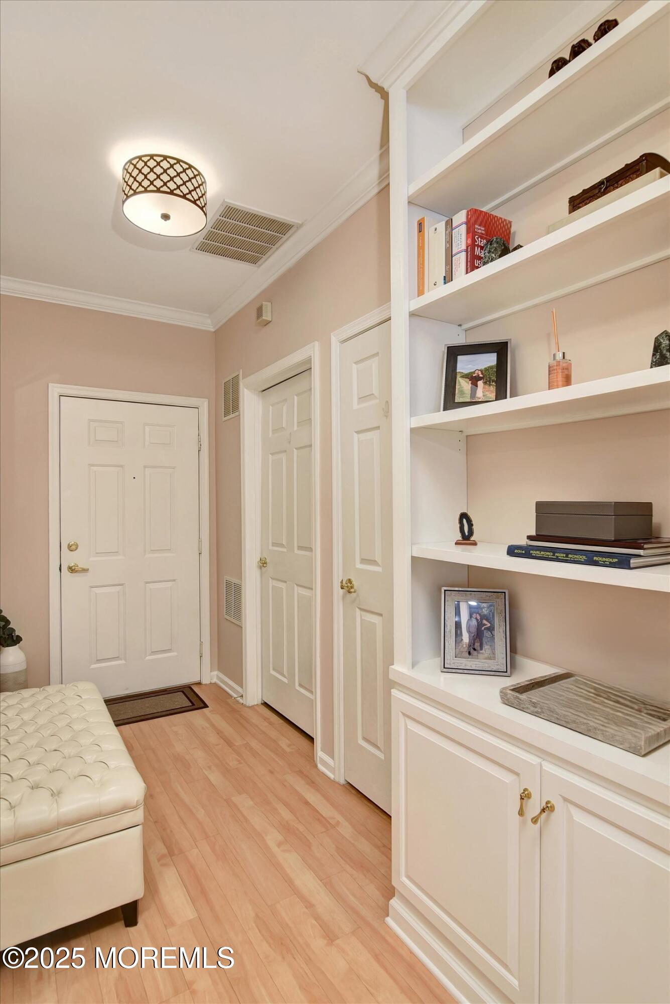 594 St Andrews Place Manalapan, NJ 07726 - Photo 25 of 35 a bedroom with a bed and a book shelf
