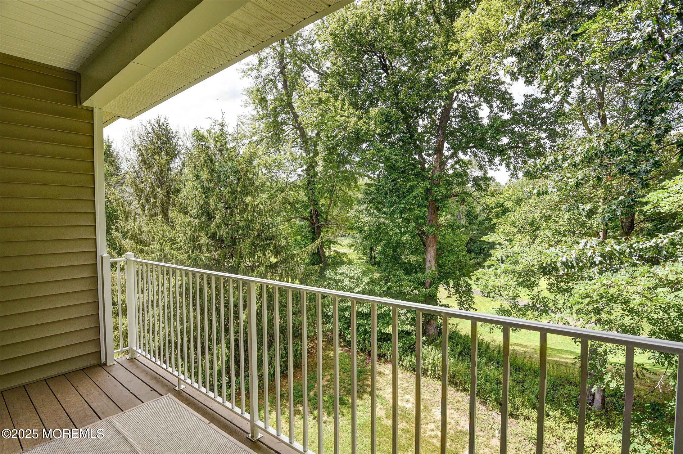 594 St Andrews Place Manalapan, NJ 07726 - Photo 27 of 35 a view of a balcony with wooden floor