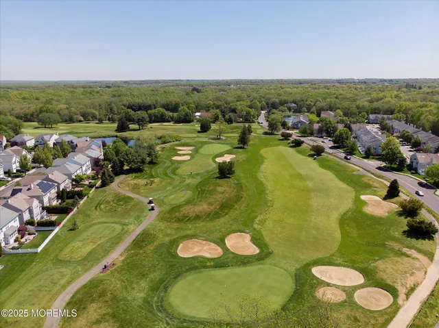 a view of a swimming pool with a table and chairs