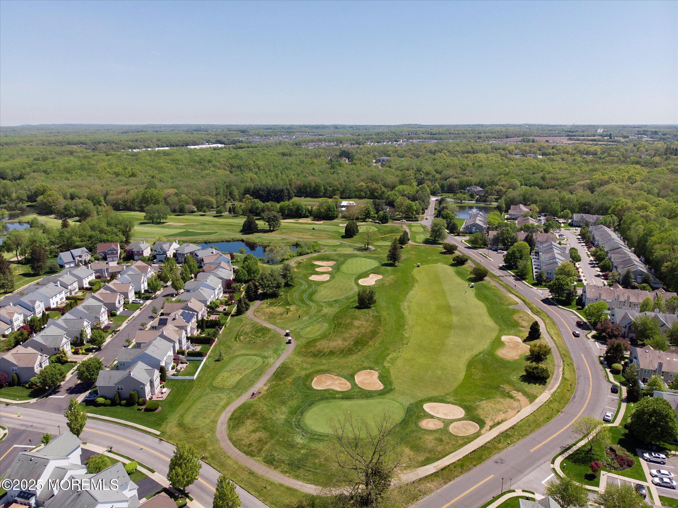 594 St Andrews Place Manalapan, NJ 07726 - Photo 34 of 35 an aerial view of residential houses with outdoor space