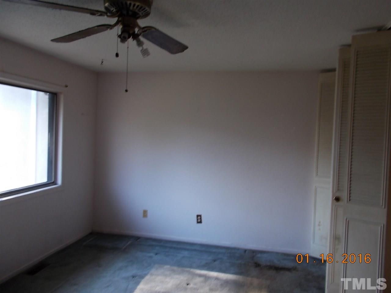 4313 Lake Ridge Drive, Unit 9E Raleigh, NC 27604 - Photo 12 of 16 an empty room with a window