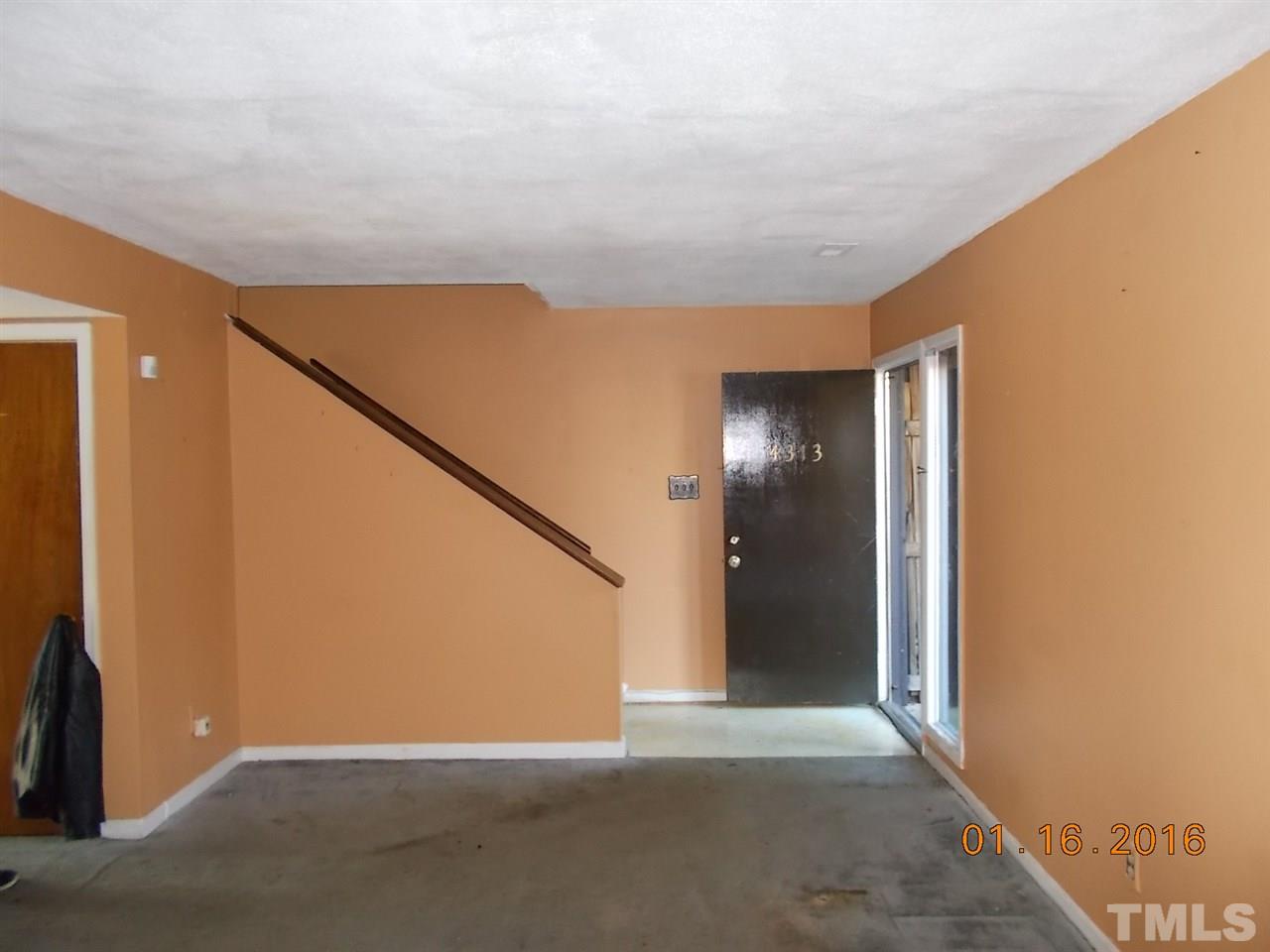 4313 Lake Ridge Drive, Unit 9E Raleigh, NC 27604 - Photo 16 of 16 a view of an empty room with wooden floor