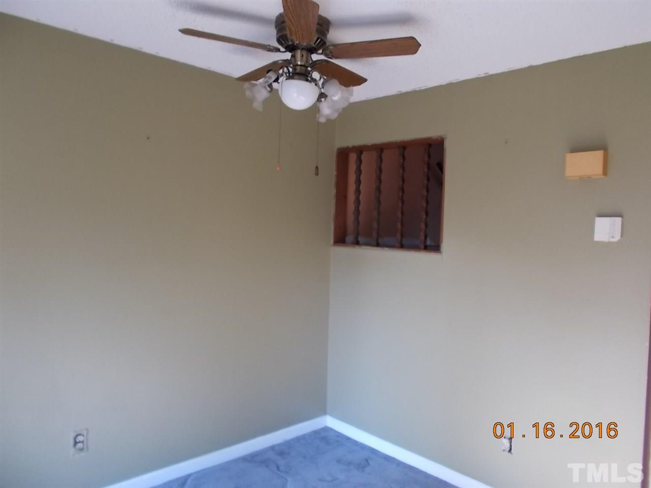 4313 Lake Ridge Drive, Unit 9E Raleigh, NC 27604 - Photo 5 of 16 a view of a hallway with a fan