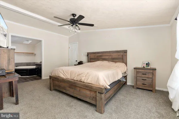 a bed room with a bed and a window
