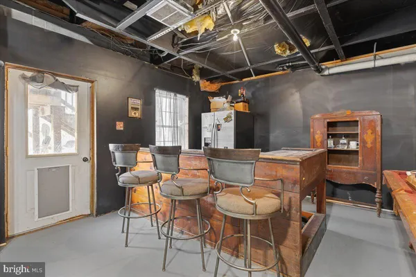 a outdoor living space with furniture and a rug