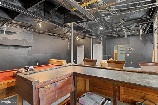 a view of a dinning table and chairs in patio of the house