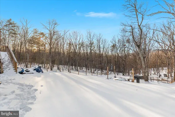 a white bath tub sitting in middle of snow