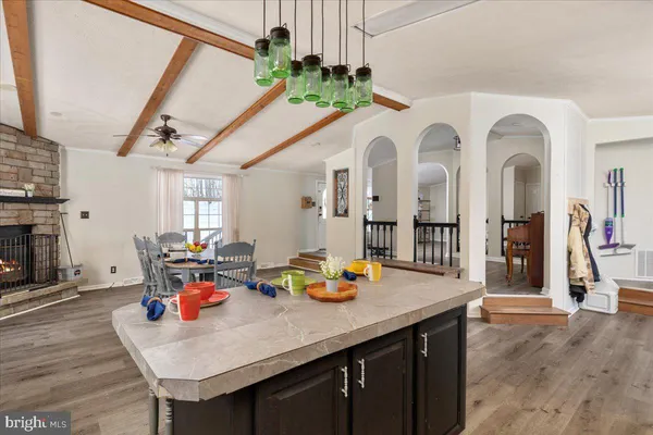 a view of dining room with furniture and wooden floor
