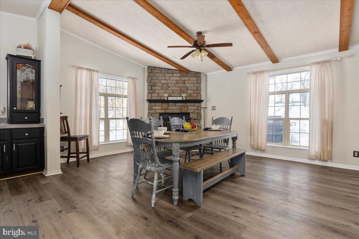 1501 South Timber Ridge Road Cross Junction, VA 22625 - Photo 7 of 66 a living room with a table chairs and a wooden floor