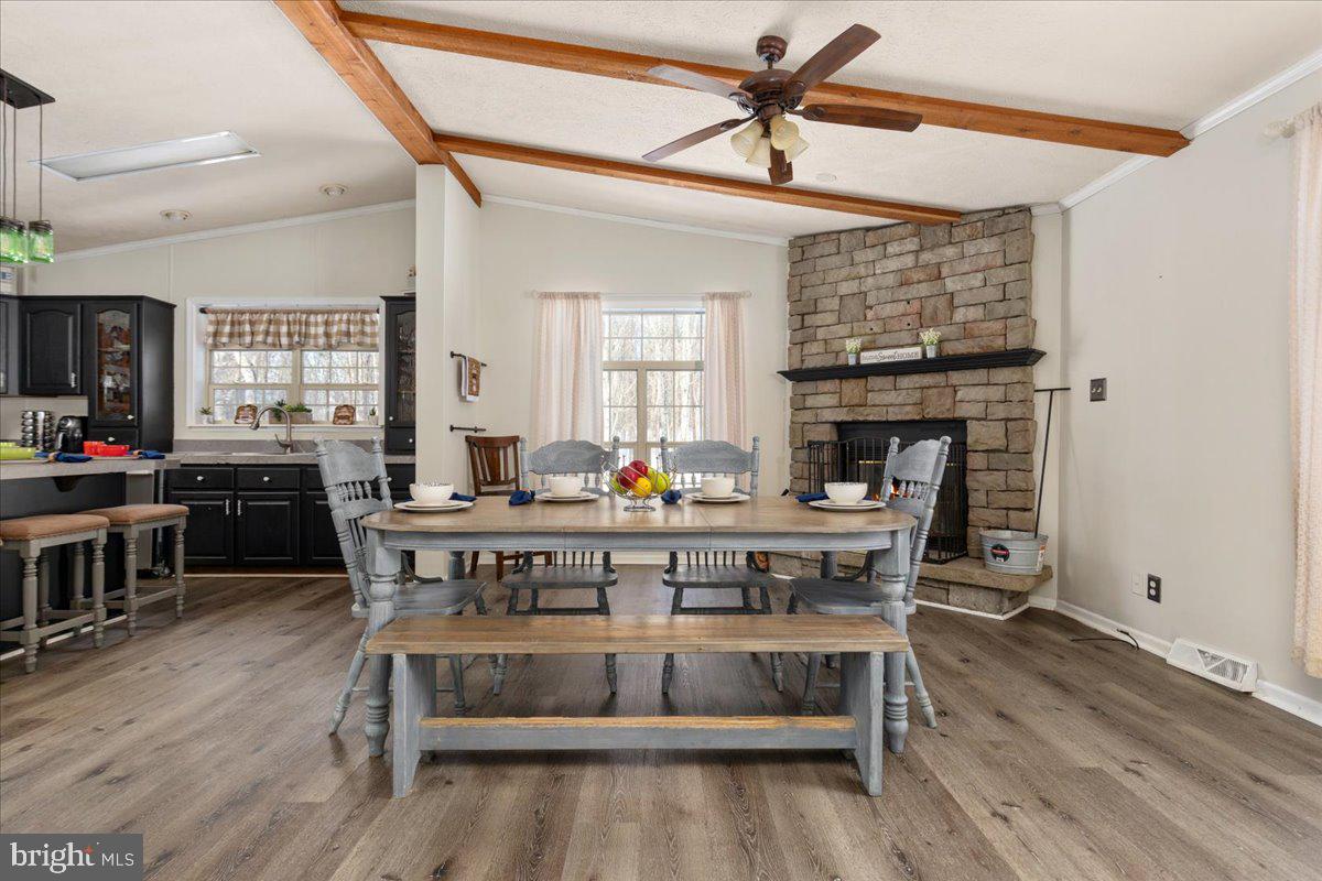 1501 South Timber Ridge Road Cross Junction, VA 22625 - Photo 8 of 66 a view of a dining room with furniture window and wooden floor