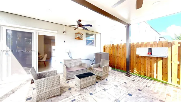 a living room with furniture and a window