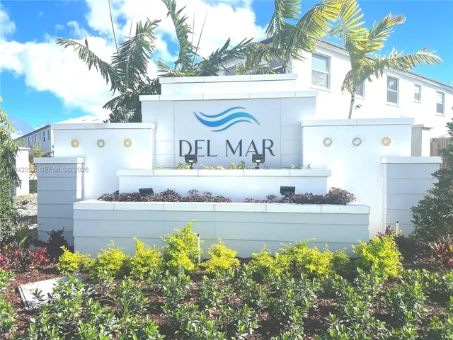 a view of a street with a building in the background