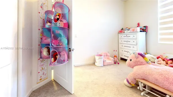 a bedroom with toys and a table
