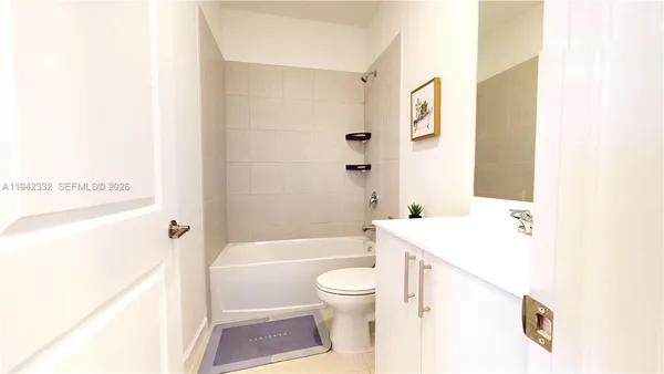 a bathroom with a sink a toilet and a bathtub