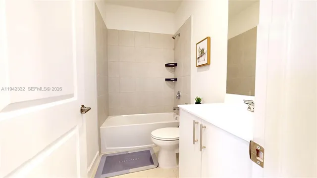 a bathroom with a sink a toilet and a bathtub