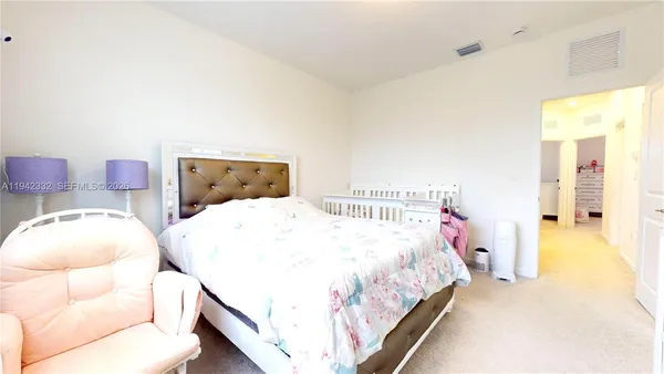 a bedroom with two beds and painted walls