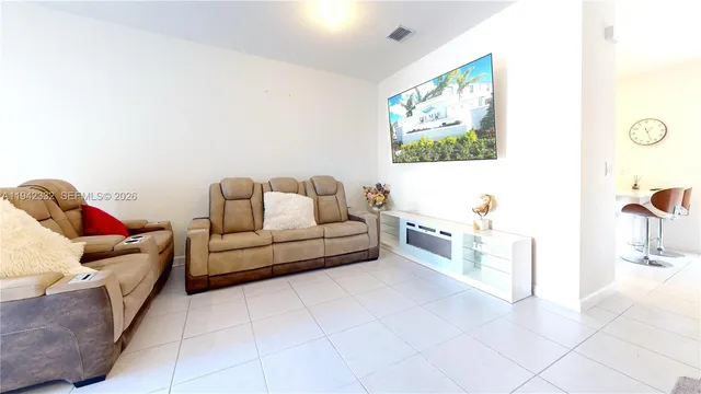 a living room with furniture and a couch