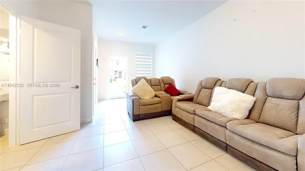 a living room with furniture and a couch