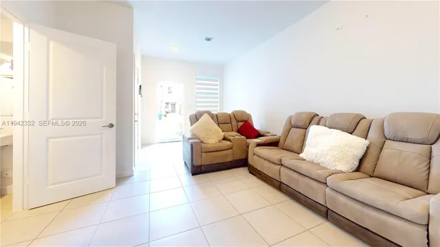 a living room with furniture and a couch