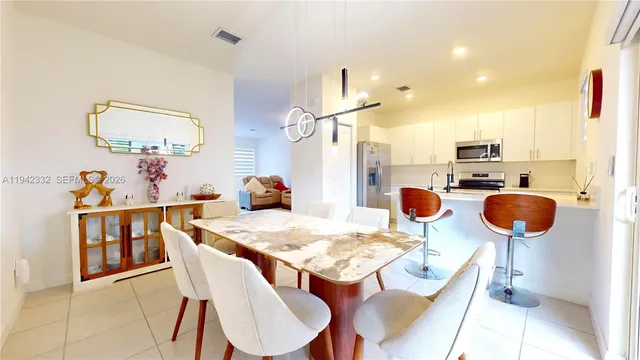 a view of a dining room with furniture
