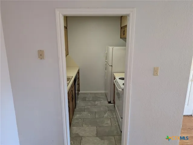 a bathroom with a sink and washing machine