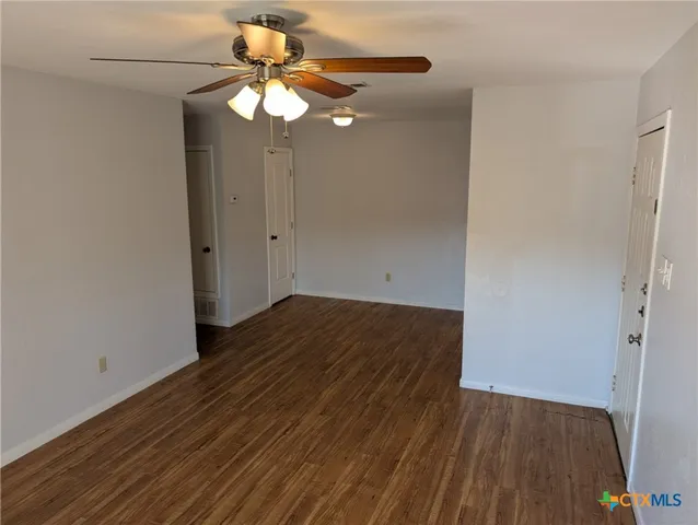 a view of a livingroom with wooden floor