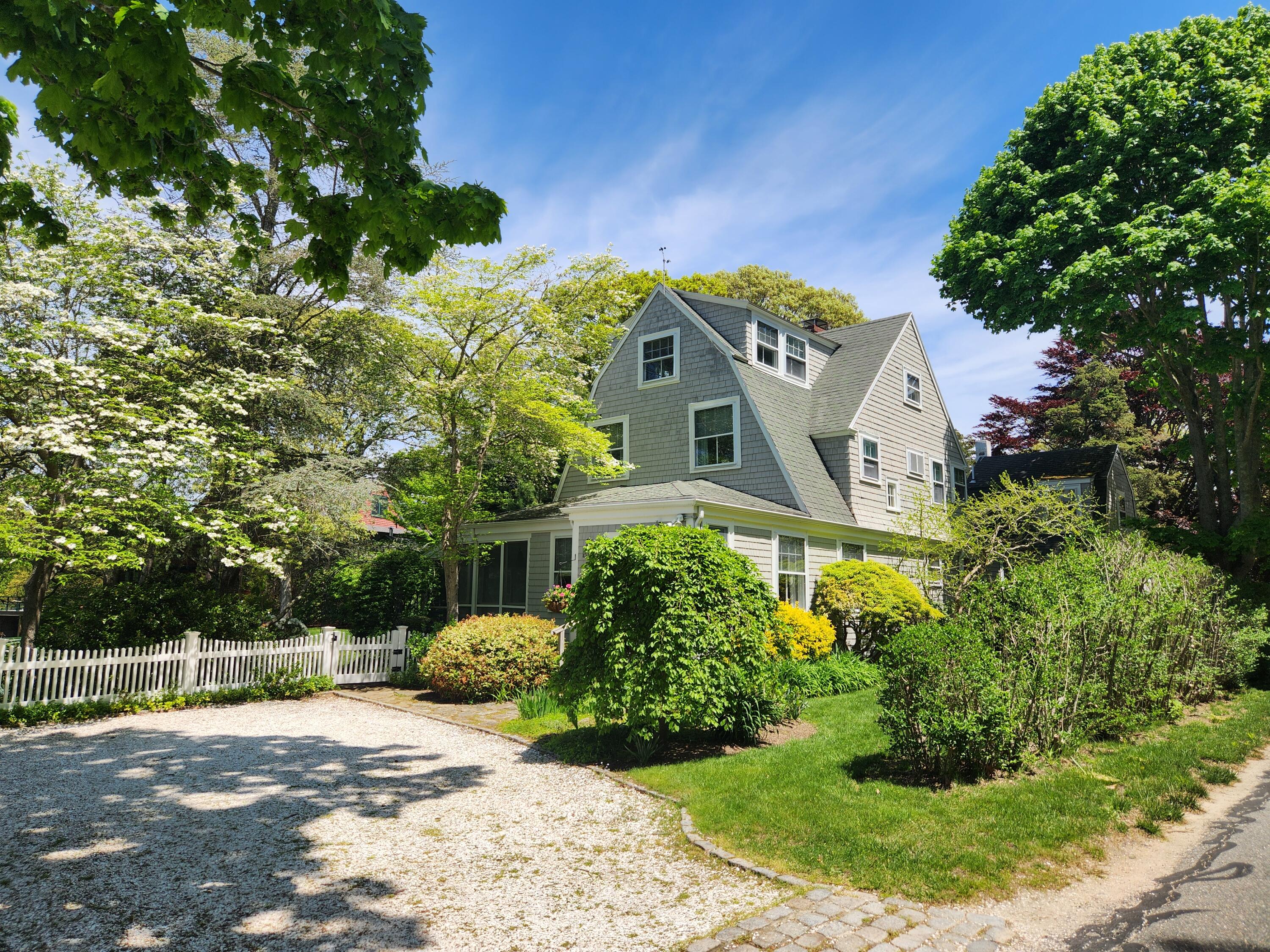 250 Scraggy Neck Road Cataumet, MA 02534 - Photo 2 of 86 a front view of a house with a yard