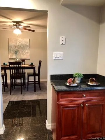a dining room with furniture and a window
