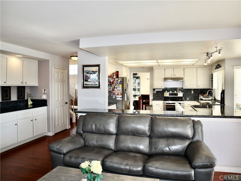 21475 Dickinson Road Moreno Valley, CA 92557 - Photo 14 of 41 a living room with furniture and wooden floor