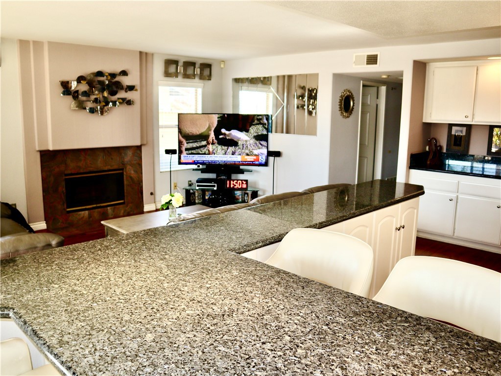 21475 Dickinson Road Moreno Valley, CA 92557 - Photo 15 of 41 a living room with furniture and a fireplace